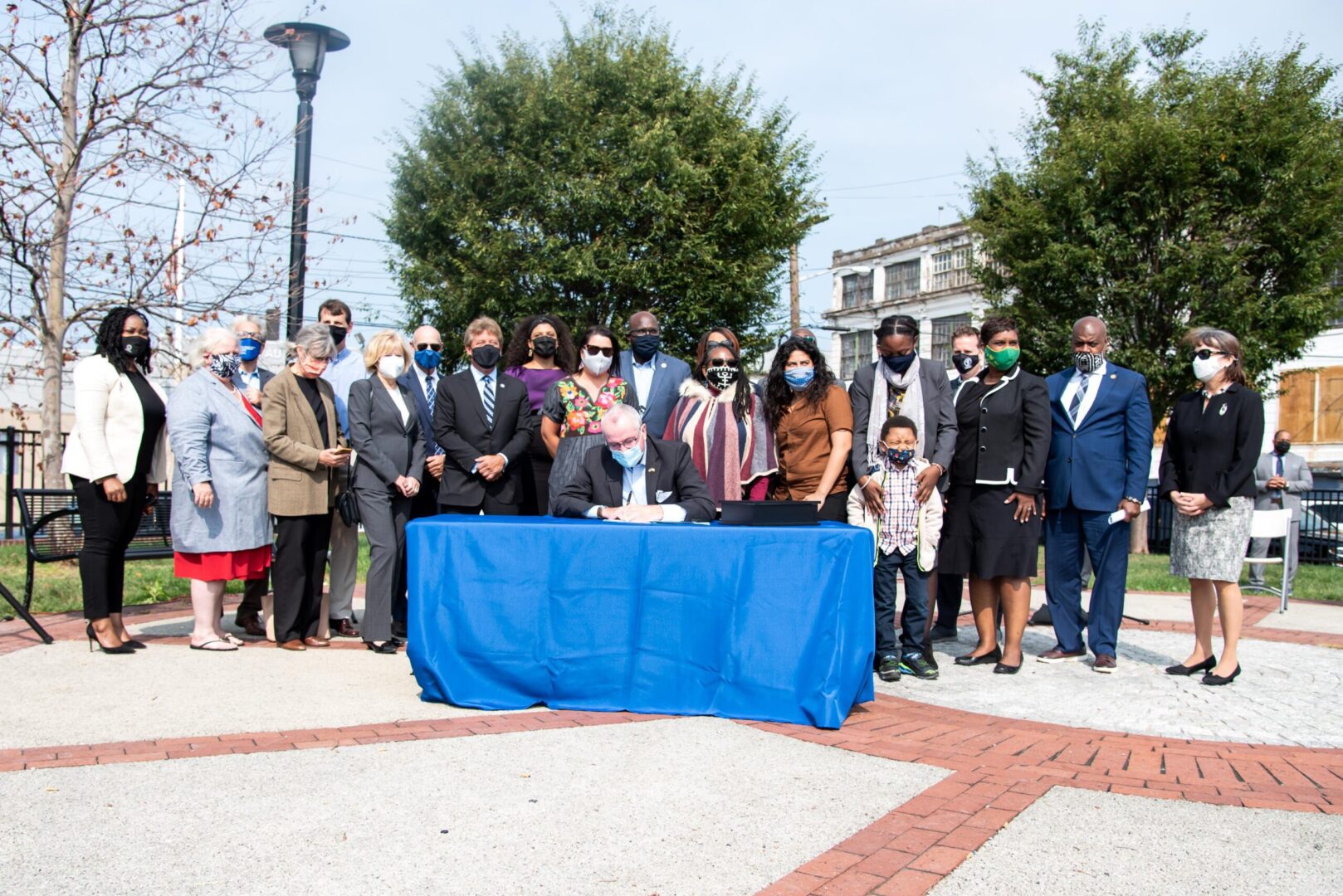 Folks gathered at the environmental justice signing